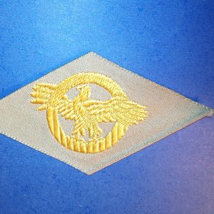 ORIGINAL WW2 HONORABLE DISCHARGE PATCH "RUPTURED DUCK" ON TAN CLOTH